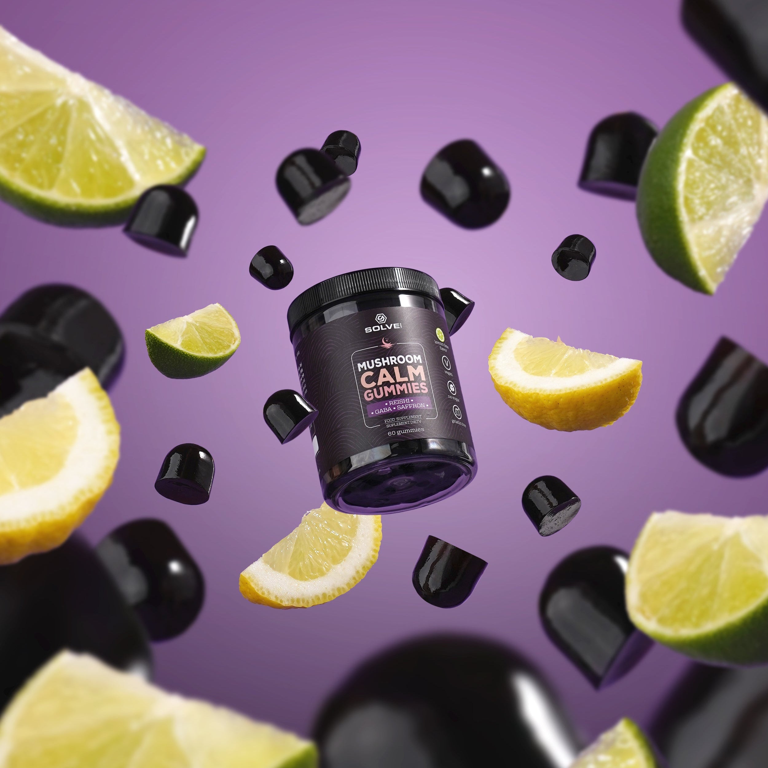 Supplement container with lime slices and black capsules on a purple background
